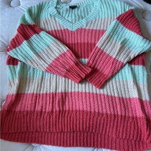 Interesting color combo. Mint green with coral and pink.